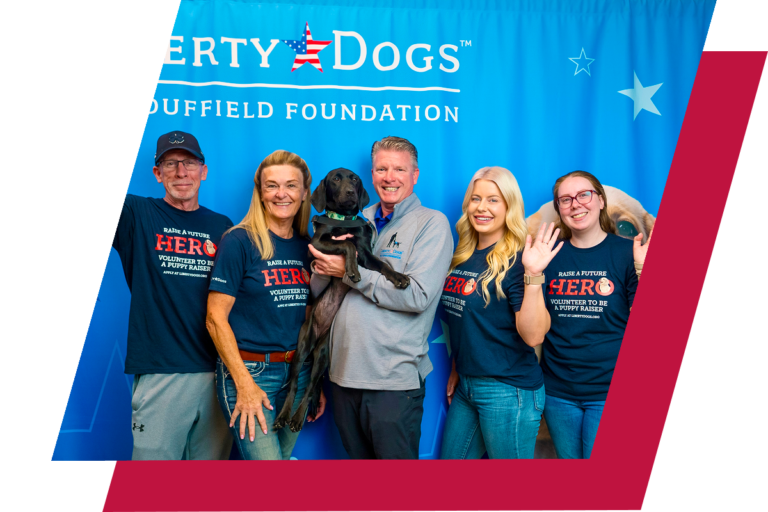 Liberty Dogs team posing together at an event.